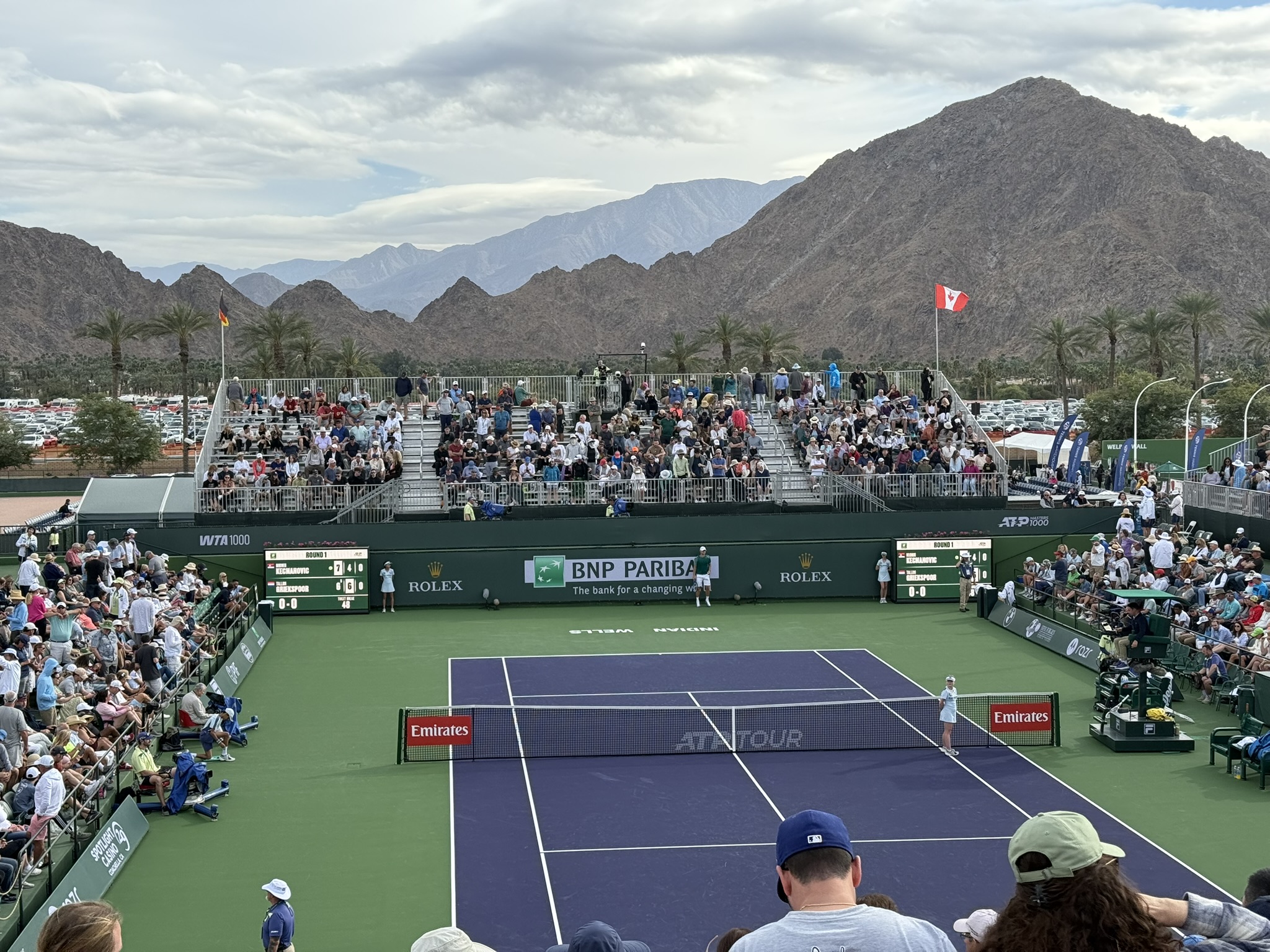 Top players practicing at Indian Wells Tennis Garden under desert sky
