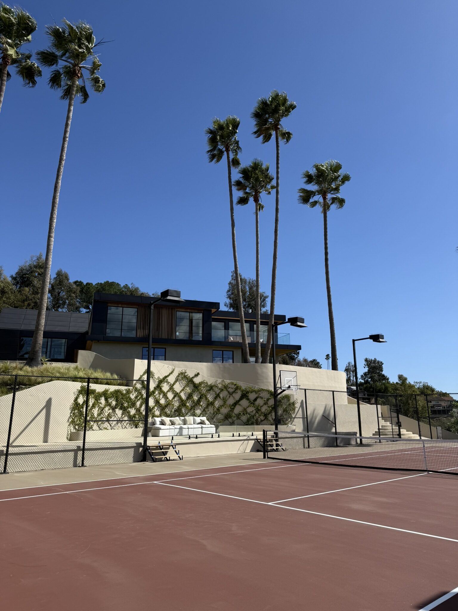 Private tennis court at FRAME luxury home representing LA racquet culture